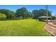 Spacious backyard with lush greenery, mature trees, and an outdoor seating area at 105 Carrie Ln # 3, Cherryville, NC 28021