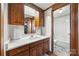 Bright bathroom featuring granite countertops, a decorative mirror, and tile accents at 105 Carrie Ln # 3, Cherryville, NC 28021