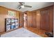 Charming bedroom with wood paneling, storage shelves, and a neutral rug at 105 Carrie Ln # 3, Cherryville, NC 28021