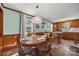 Inviting dining area with wood table, pendant lighting, wainscoting, and an open view to the kitchen at 105 Carrie Ln # 3, Cherryville, NC 28021