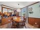 Inviting dining area with a round wood table, pendant lighting, and views into the adjacent living area at 105 Carrie Ln # 3, Cherryville, NC 28021