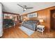 Comfortable living room with hardwood floors, wood paneling, and an open view into the dining area at 105 Carrie Ln # 3, Cherryville, NC 28021