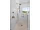 Shower with white subway tile, a bronze shower head, and built-in niche for storage at 114 Wilharr Ct # 38, Mooresville, NC 28115