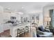 Modern kitchen with white cabinets, granite countertops, stainless steel appliances, and a breakfast bar at 115 Falling Up Ln, Salisbury, NC 28147