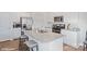 Stylish kitchen island featuring granite countertops, stainless steel appliances, and white cabinetry at 115 Falling Up Ln, Salisbury, NC 28147
