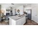 Open concept living area featuring a kitchen island with stainless steel appliances and modern finishes at 115 Falling Up Ln, Salisbury, NC 28147