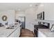 Well-designed kitchen featuring stainless steel appliances, granite counters, white cabinets, and hardwood floors at 115 Falling Up Ln, Salisbury, NC 28147