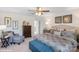 Spacious main bedroom with a ceiling fan, neutral carpet, and decor at 115 Falling Up Ln, Salisbury, NC 28147