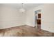 Elegant dining room featuring hardwood floors, crown molding, and a stylish chandelier at 12117 Idlewild Rd, Matthews, NC 28105