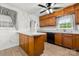 Well-maintained kitchen featuring wood cabinets, and a breakfast bar for casual dining at 12117 Idlewild Rd, Matthews, NC 28105