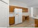 Bright and spacious kitchen with ample counter space, wood cabinets, and modern appliances at 12317 Panthersville Dr, Charlotte, NC 28269
