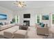 Bright living room features a decorative fireplace, plush seating, and modern decor at 12317 Panthersville Dr, Charlotte, NC 28269