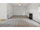 Expansive living room with fireplace and carpet, offering ample space for decor at 12317 Panthersville Dr, Charlotte, NC 28269