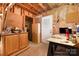 Unfinished basement featuring exposed ceiling and storage cabinets at 1407 Jodhpur Ct, Charlotte, NC 28212