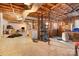 Unfinished basement featuring concrete floor, exposed ceiling, and storage at 1407 Jodhpur Ct, Charlotte, NC 28212