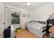 Bright bedroom with a window, hardwood floors and a ceiling fan at 1407 Jodhpur Ct, Charlotte, NC 28212