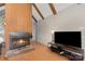 Spacious living area featuring a fireplace and modern entertainment center at 1407 Jodhpur Ct, Charlotte, NC 28212