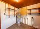 Unfinished basement with a water heater, shelving, and concrete walls at 1468 Hilltop St, Albemarle, NC 28001