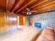 Finished basement with wood-paneled walls, a brick fireplace, and recessed lighting at 1468 Hilltop St, Albemarle, NC 28001