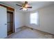 Bedroom featuring white walls, carpeting and a closet space at 1468 Hilltop St, Albemarle, NC 28001
