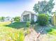 Home exterior with screened porch, mature landscaping and well-maintained lawn at 1468 Hilltop St, Albemarle, NC 28001