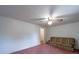 Living room with pink carpet and ceiling fan at 1468 Hilltop St, Albemarle, NC 28001