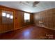 Bedroom featuring wood paneling and hardwood floors at 1470 Hilltop St, Albemarle, NC 28001