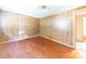 Bedroom featuring wood paneling and hardwood floors at 1470 Hilltop St, Albemarle, NC 28001