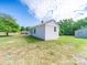 Exterior view of home with white siding and green lawn at 1470 Hilltop St, Albemarle, NC 28001
