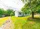 Side view of a single-story home with green lawn at 1470 Hilltop St, Albemarle, NC 28001