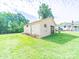 Exterior view of a garage with a grassy lawn at 1470 Hilltop St, Albemarle, NC 28001
