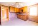 A kitchen with wood cabinets and laminate flooring at 1470 Hilltop St, Albemarle, NC 28001