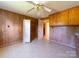 Room with wood paneling and vintage storage cabinet at 1470 Hilltop St, Albemarle, NC 28001