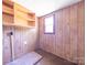 Room with wood paneling and a brick element at 1470 Hilltop St, Albemarle, NC 28001