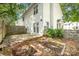 Backyard with a patio, landscaped garden bed, and a wooden fence at 1533 Briar Creek Rd # A, Charlotte, NC 28205