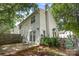 Exterior of home with a patio, fenced yard, and lush greenery at 1533 Briar Creek Rd # A, Charlotte, NC 28205