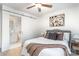 Bedroom featuring a sliding door to the bathroom, a ceiling fan, and comfortable decor at 1533 Briar Creek Rd # A, Charlotte, NC 28205