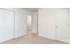 Minimalist bedroom with a carpet flooring and multiple doors for closet and hall access at 1533 Briar Creek Rd # A, Charlotte, NC 28205