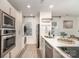 Bright kitchen boasting stainless steel appliances, a breakfast bar, and functional design at 1533 Briar Creek Rd # A, Charlotte, NC 28205