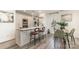 Open kitchen featuring a breakfast bar, modern appliances, and stylish dining area at 1533 Briar Creek Rd # A, Charlotte, NC 28205