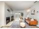 Cozy living room featuring a fireplace, elegant decor, and lots of natural light at 1533 Briar Creek Rd # A, Charlotte, NC 28205
