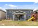Large backyard features an outdoor living space, including a hot tub and playset for Gathering enjoyment at 1601 Calder Dr, Indian Trail, NC 28079