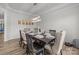 Cozy dining room with a dark wood table, upholstered chairs, and modern lighting fixture at 1601 Calder Dr, Indian Trail, NC 28079