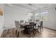Elegant dining room with a stylish chandelier, dark wood table, and seating for six at 1601 Calder Dr, Indian Trail, NC 28079