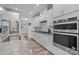 Beautiful modern kitchen with stainless steel appliances, granite countertops, and white cabinets at 1601 Calder Dr, Indian Trail, NC 28079