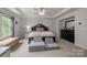 Comfortable main bedroom with a tray ceiling, plush carpet, and plenty of natural light at 1601 Calder Dr, Indian Trail, NC 28079