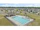 Aerial view of a large community pool and clubhouse, surrounded by residential homes and green spaces at 1601 Calder Dr, Indian Trail, NC 28079