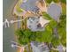 Stunning aerial view of a lakeside home with private dock and lush landscaping at 16108 Woolwine Rd, Charlotte, NC 28278