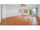 Bright bedroom with hardwood floors, multiple windows, and balcony access overlooking waterfront at 16108 Woolwine Rd, Charlotte, NC 28278