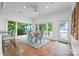 Bright dining area features floor-to-ceiling windows and a beautiful view of the outside at 16108 Woolwine Rd, Charlotte, NC 28278